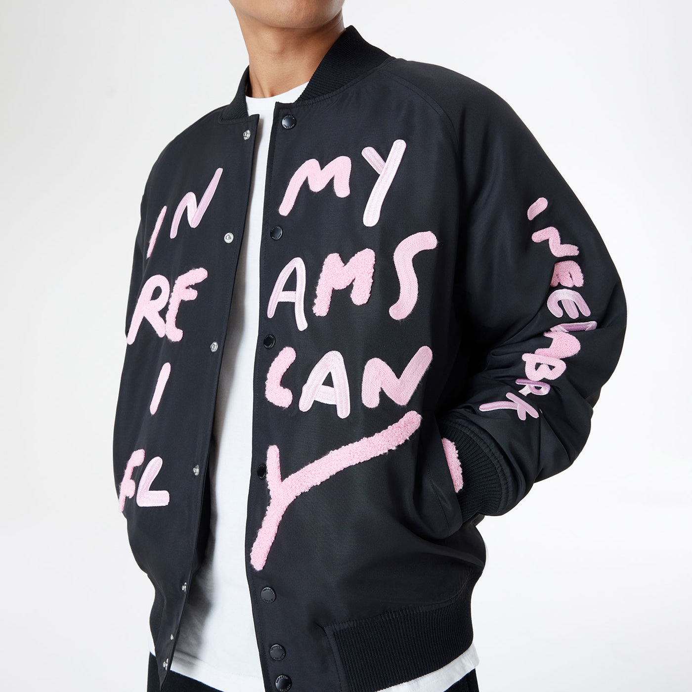 NEW ERA X RICARDO LUEVANOS IN DREAM I CAN FLY SCRIPT BLACK OVERSIZED VARSITY JACKET