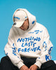 NEW ERA X RICARDO LUEVANOS NOTHING LASTS FOREVER SCRIPT CHROME WHITE OVERSIZED HOODIE